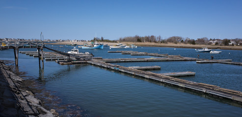 Fototapeta na wymiar Floating Wooden Boat Docks and Ramp