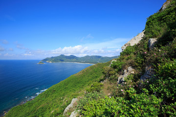 Fototapeta na wymiar beautiful seaside mountain landscape under blue sky
