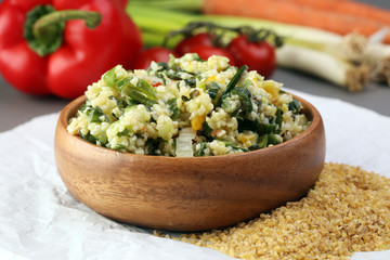 Tabbouleh salad with bulgur, parsley and vegetables -diet concept