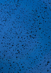 Drops of water on the car window, nature background