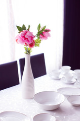 Served table with peony bouquet