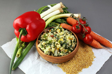 Tabbouleh salad with bulgur, parsley and vegetables -diet concept