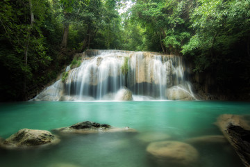 Fototapeta na wymiar Erawan Waterfall is a beautiful waterfall in spring forest in Kanchanaburi province, Thailand.