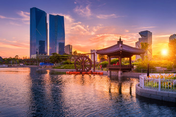 Traditional and modern architecture of seoul city in sunset, central park in songdo International...