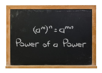 Power of a power written in white chalk on a black chalkboard isolated on white