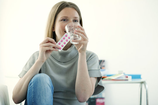 Woman taking antispasmodic