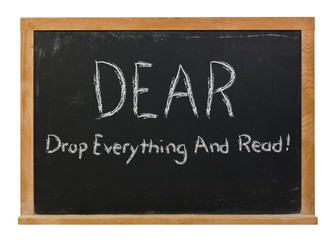 Obraz premium DEAR drop everything and read written in white chalk on a black chalkboard isolated on white