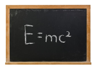 Fototapeta premium E=mc squared written in white chalk on a black chalkboard isolated on white