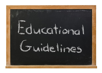 Obraz premium Educational Guidelines written in white chalk on a black chalkboard isolated on white