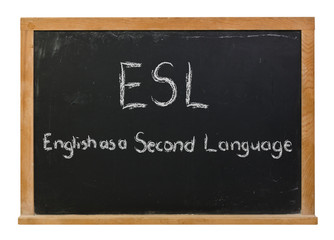 ESL English as a second language written in white chalk on a black chalkboard isolated on white © clsdesign