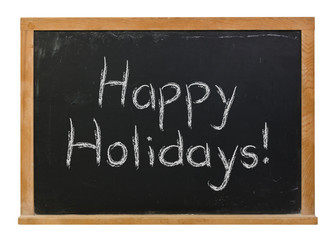 Fototapeta premium Happy holidays written in white chalk on a black chalkboard isolated on white