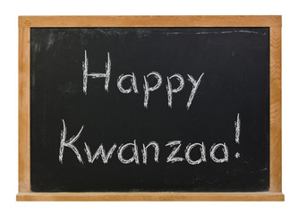 Fototapeta premium Happy Kwanzaa written in white chalk on a black chalkboard isolated on white