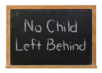 Obraz premium No child left behind written in white chalk on a black chalkboard isolated on white 