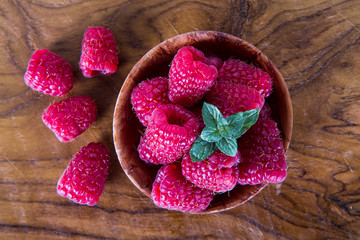 Raspberries on wooden background
