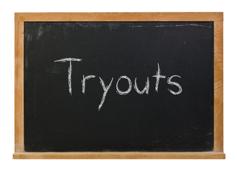 Obraz premium Tryouts written in white chalk on a black chalkboard isolated on white