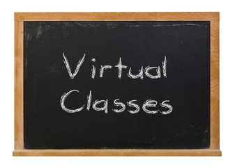 Virtual Classes written in white chalk on a black chalkboard isolated on white