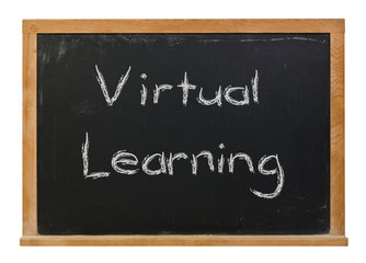 Obraz premium Virtual Learning written in white chalk on a black chalkboard isolated on white