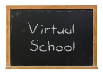 Virtual school written in white chalk on a black chalkboard isolated on white