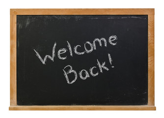 Obraz premium Welcome back written in white chalk on a black chalkboard isolated on white