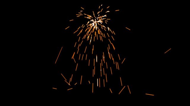 Welding Particles Falling On A Black Background