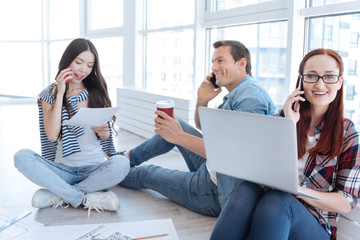 Positive nice people having phone conversations