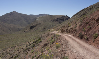 Road through desert and mountains