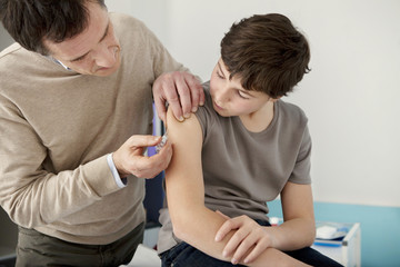 Obraz na płótnie Canvas Vaccinating a child