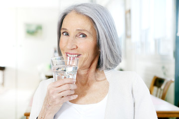 Elderly person with cold drink