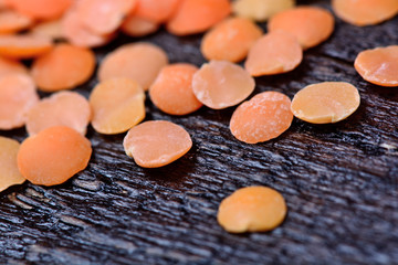 Many red lentils on table