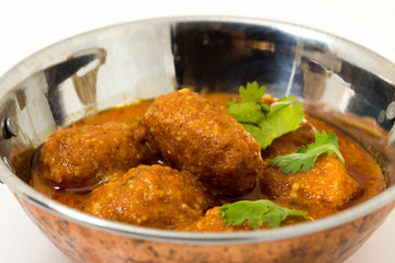 Malai Kofta or meatballs - Traditional Indian food  served in a brass utensil