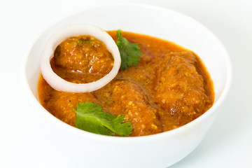 Malai Kofta or meatballs - Traditional Indian food  served in white bowl of bonechina