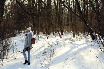 Woman walking outdoors in nature, snow forest