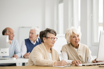 Women practising using computer