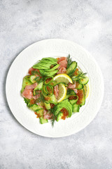 Vegetable salad with salmon and red caviar.Top view.