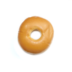 Fototapeta na wymiar Glazed donut isolated on a white background