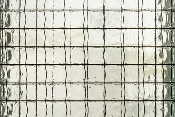Double glass with reinforcing mesh of steel wire, abstract background