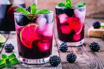 Blackberry mojito  cocktail  with lime, and mint