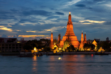 Twilight time of Wat Arun across Chao Phraya River in Bangkok, Thailand