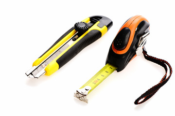 Tape measure with belt clip and utility knife