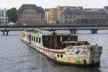 an old abandoned ship on the spree river in berlin germany