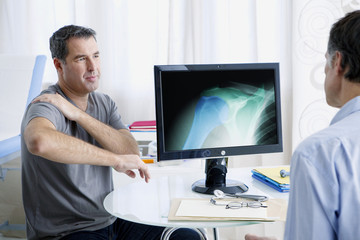 Male patient consulting for shoulder pain