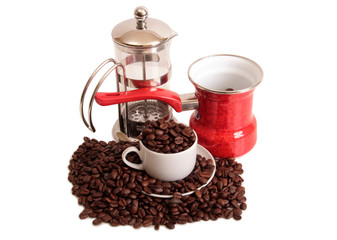 Coffee beans and a white cup on white background