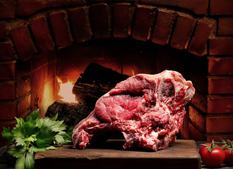 Raw beef meat on a wooden table 