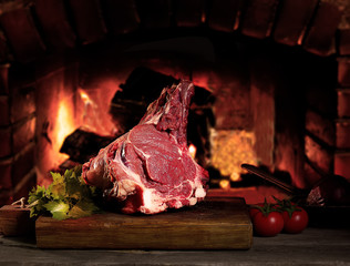 Raw beef meat on a wooden table 