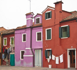 Burano, near Venice, Italy. Bright colored houses and laundry hung up to dry