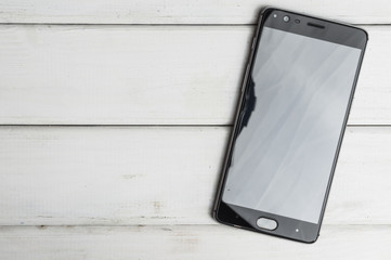 Smartphones on wooden background