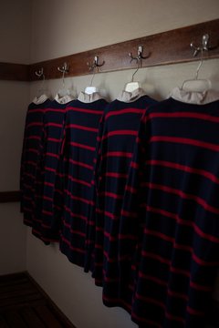 Rugby shirts hanging in room