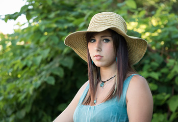 Close-up of young woman with hat