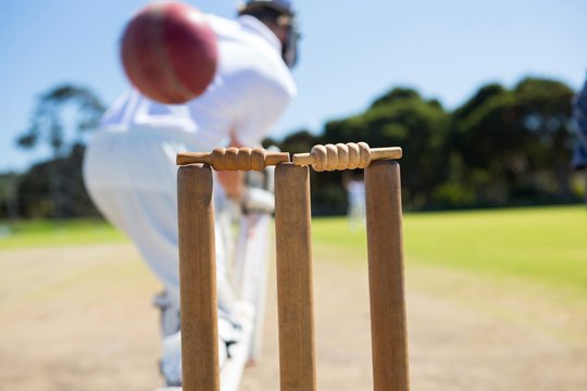 Close up of ball by stump against batsman