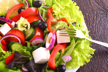 Fresh vegetables on wooden and blur background
